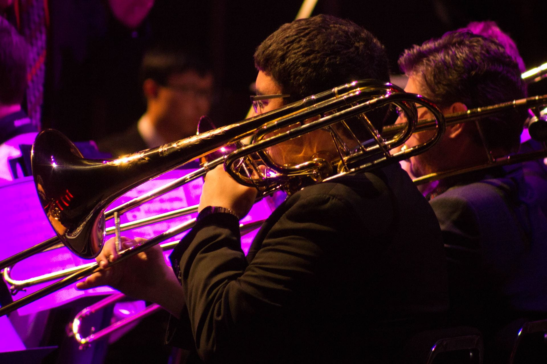 Three Jazz Band students performing at a concert.