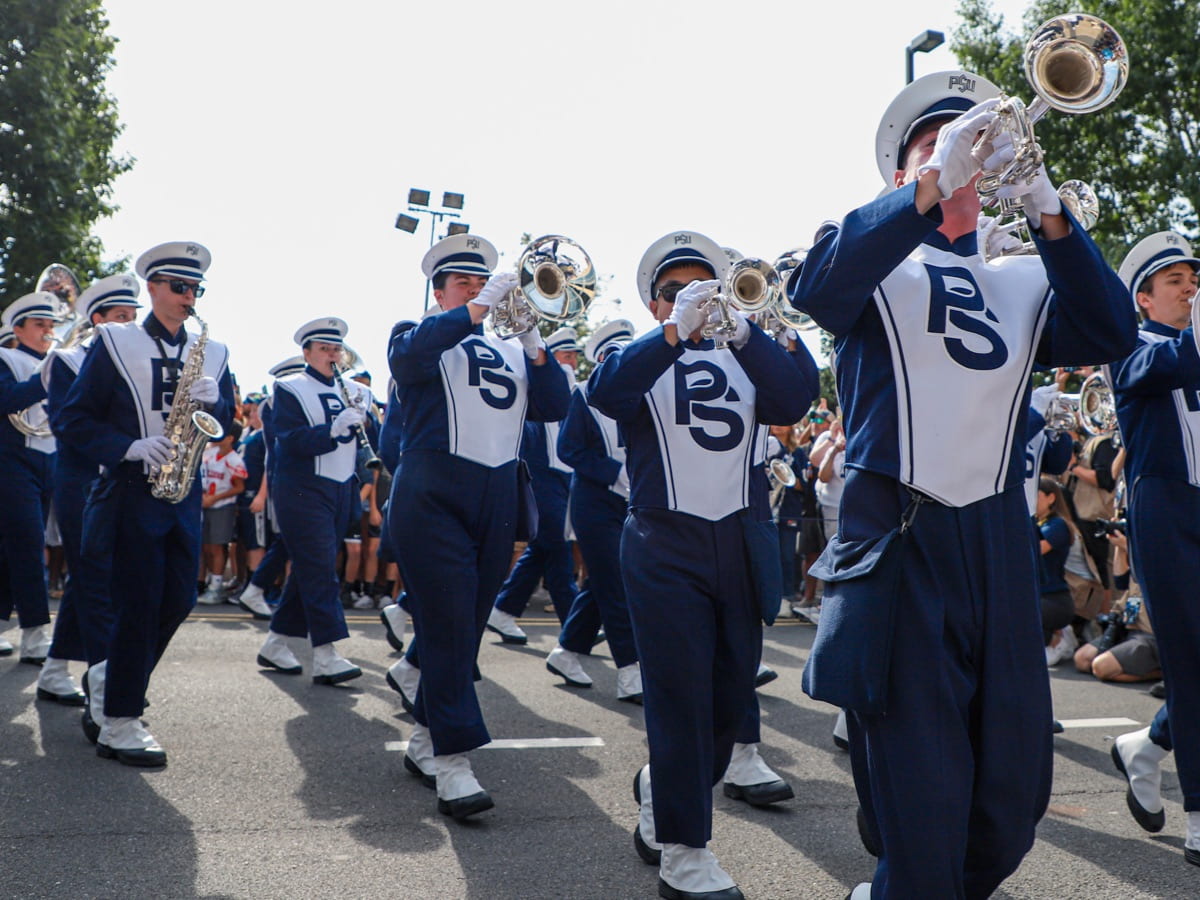 Masked Blue Band performing in front of Beaver Stadium.